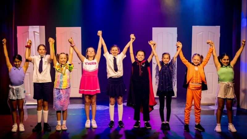 Kids taking a bow after performing arts classes at Evoke Performing Arts Academy Palmyra Perth.