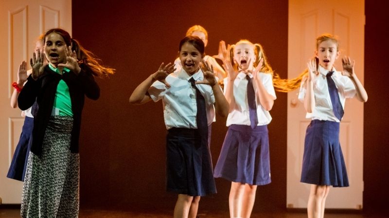 Kids singing in their performing arts performance at Evoke Performing Arts Academy Palmyra Perth.