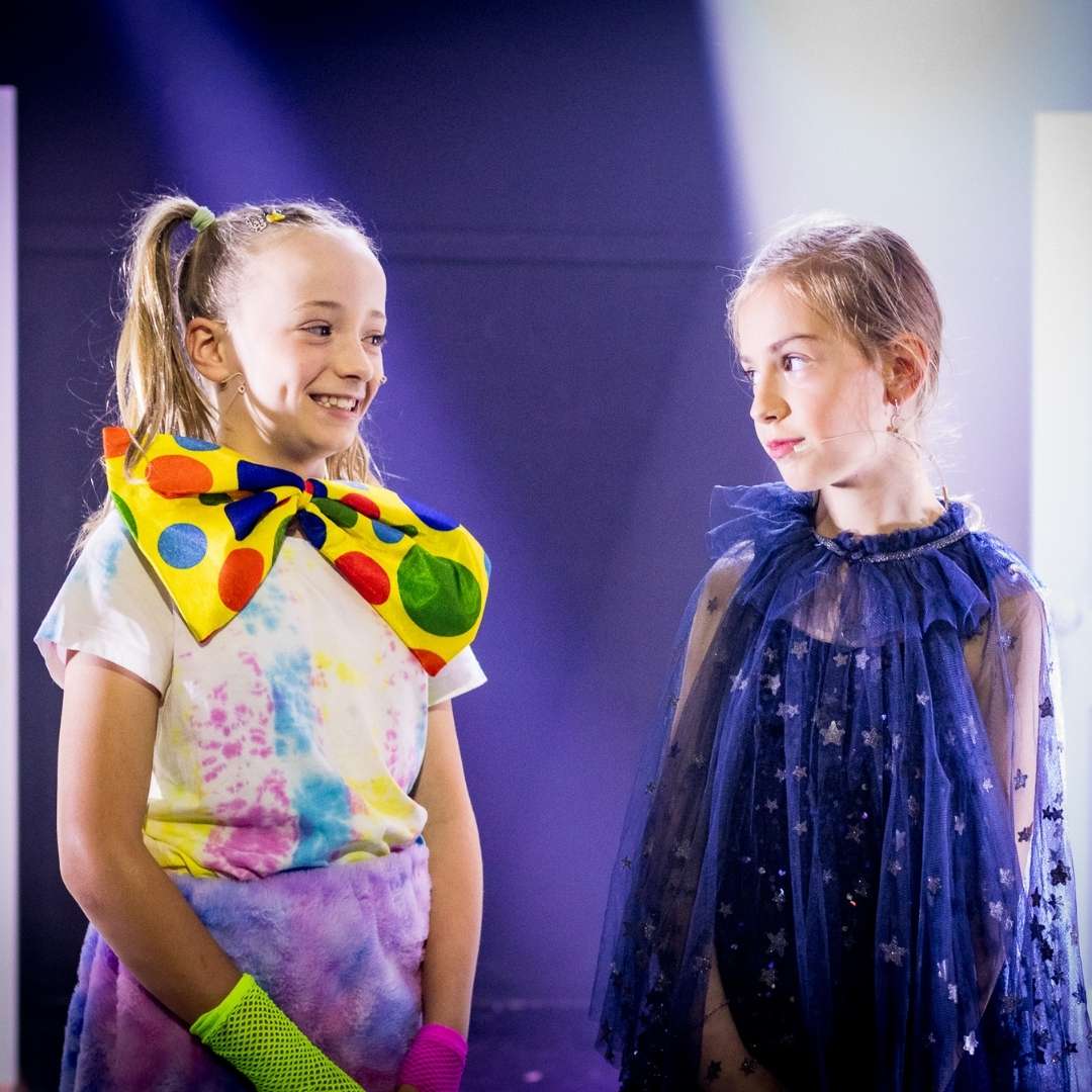 Two drama students looking at each other while onstage at evoke performing arts academy in Palmyra.