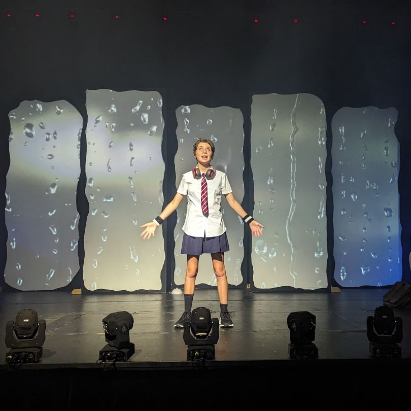 Solo singing performance pose from a student of Evoke performing arts classes in Palmyra Perth.