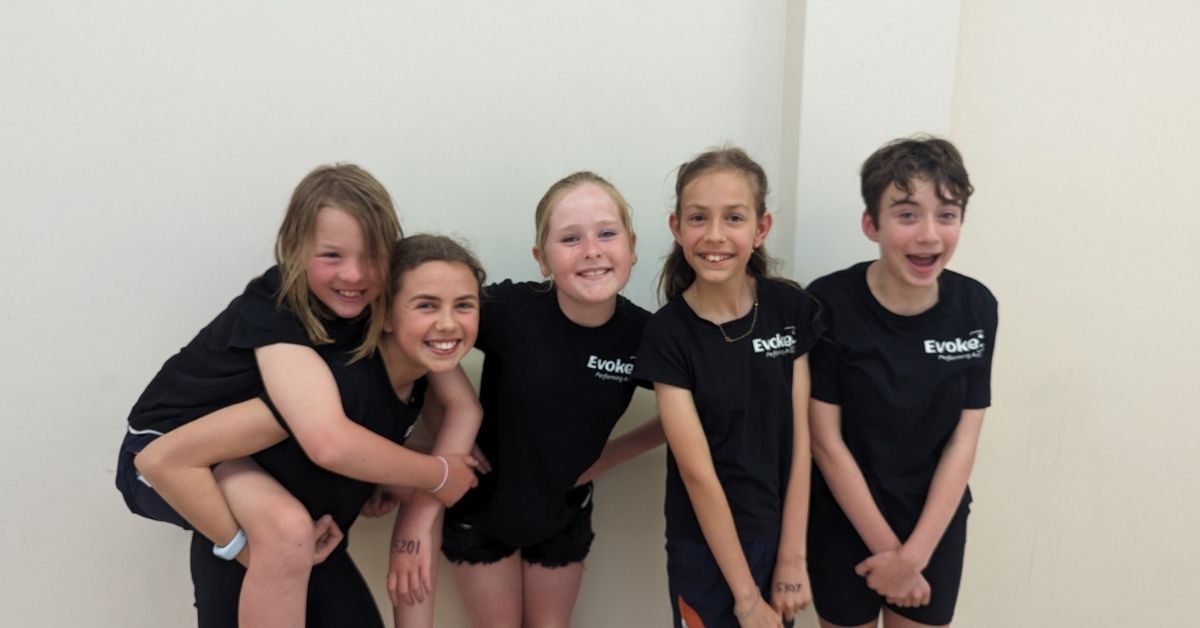 Kids working together in a group performing arts class at Evoke, Palmyra Perth.